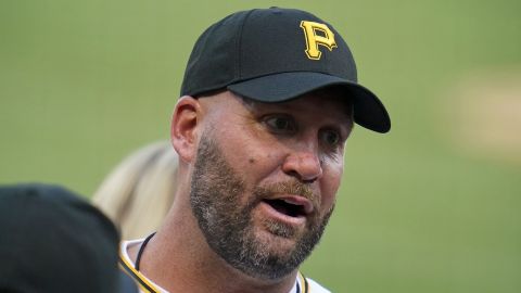 Retired Pittsburgh Steelers quarterback Ben Roethlisberger talks with Pittsburgh Pirates relief pitcher David Bednar before throwing out a ceremonial first pitch before a baseball game between the Pirates and the Philadelphia Phillies in Pittsburgh, Friday, July 29, 2022. (AP Photo/Gene J. Puskar)