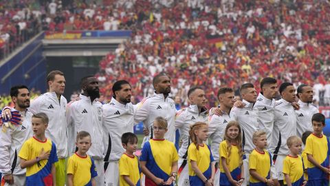 Germany's team listen to the national anthem during a quarter final match between Germany and Spain at the Euro 2024 soccer tournament in Stuttgart, Germany, Friday, July 5, 2024. (AP Photo/Matthias Schrader)