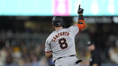 San Francisco Giants' Michael Conforto celebrates his home run during the sixth inning of a baseball game against the San Diego Padres, Friday, Sept. 6, 2024, in San Diego. (AP Photo/Gregory Bull)