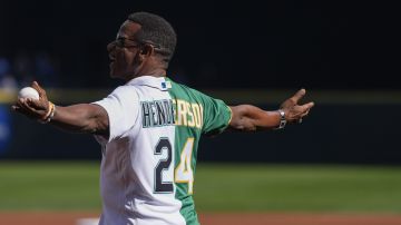 Former Seattle Mariners and Oakland Athletics player Rickey Henderson walks out to deliver the ceremonial first pitch before a baseball game between the Mariners and Athletics, Sunday, Sept. 29, 2024, in Seattle. (AP Photo/Lindsey Wasson)