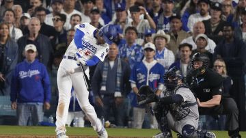 Los Angeles Dodgers' Freddie Freeman connects for a walk-off grand slam home run during the 10th inning in Game 1 of the baseball World Series against the New York Yankees, Friday, Oct. 25, 2024, in Los Angeles. (AP Photo/Mark J. Terrill)