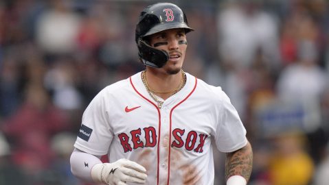 FILE - Boston Red Sox outfielder Jarren Duran, center, returns to the dugout after scoring on an error after Vaughn Grissom hit a double in the third inning of a baseball game against the Tampa Bay Rays, Sept. 29, 2024, in Boston. (AP Photo/Steven Senne, File)
