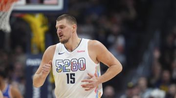 Denver Nuggets center Nikola Jokic (15) in the first half of an NBA basketball game Monday, Nov. 25, 2024, in Denver. (AP Photo/David Zalubowski)