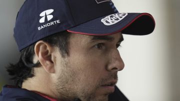 Red Bull driver Sergio Perez of Mexico at pit stop prior to the start of the qualifying race at the Formula One Qatar Grand Prix, at the Lusail International Circuit in Lusail, Qatar, Saturday, Nov. 30, 2024. (AP Photo/ Darko Bandic)