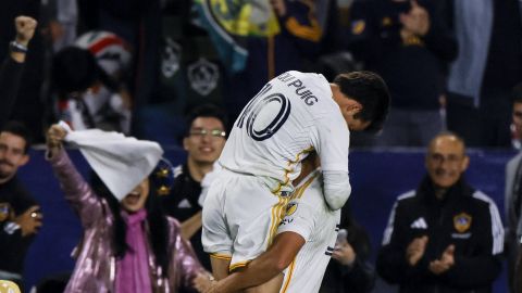 Los Angeles Galaxy forward Dejan Joveljic, right, celebrates his goal with midfielder Riqui Puig (10) during the second half of an MLS Western Conference final soccer match against the Seattle Sounders, Saturday, Nov. 30, 2024, in Carson, Calif. (AP Photo/Etienne Laurent)