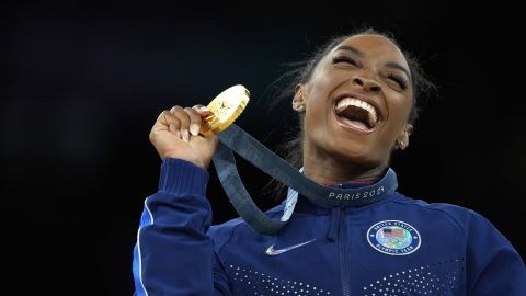 FILE - Simone Biles, of the United States, celebrates after winning the gold medal at the medal ceremony during the women's artistic gymnastics individual vault finals at Bercy Arena at the 2024 Summer Olympics, Saturday, Aug. 3, 2024, in Paris, France. (AP Photo/Francisco Seco, File)