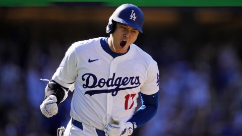 FILE - Los Angeles Dodgers' Shohei Ohtani celebrates as he heads to first for a solo home run during the ninth inning of a baseball game against the Colorado Rockies, Sunday, Sept. 22, 2024, in Los Angeles. (AP Photo/Mark J. Terrill, File)