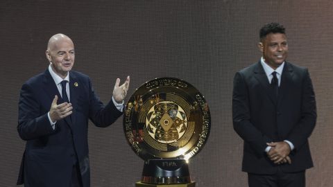 FIFA President Gianni Infantino' and Former professional Brazilian soccer player Ronaldo present a new trophy during the draw for the 2025 FIFA Club World Cup soccer tournament, Thursday, Dec. 5, 2024, in Miami. (AP Photo/Rebecca Blackwell)