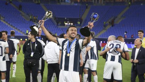 CF Pachuca's Gustavo Cabral holds up trophies after beating Ahly FC during the penalty shootout of the Intercontinental Cup soccer match at Stadium 974 in Doha, Qatar, Saturday, Dec. 14, 2024. (AP Photo/Hussein Sayed)