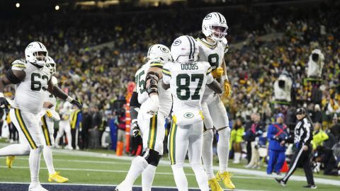 Green Bay Packers wide receiver Christian Watson (9) celebrates with guard Sean Rhyan (75) and wide receiver Romeo Doubs (87) during an NFL football game against the Seattle Seahawks, Sunday, Dec. 15, 2024 in Seattle. The Packers defeated the Seahawks 30-13. (AP Photo/Ben VanHouten)