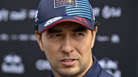 FILE - Red Bull driver Sergio Perez of Mexico arrives in the paddock before of the third free practice ahead of Sunday's Formula One Hungarian Grand Prix auto race, at the Hungaroring racetrack in Mogyorod, near Budapest, Hungary, Saturday, July 20, 2024. (AP Photo/Denes Erdos, File)