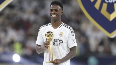 Real Madrid's Vinicius Junior poses for the photographers with the trophy as the best player of the game at the end of the Intercontinental Cup soccer final match against CF Pachuca at the Lusail Stadium in Lusail, Qatar, Wednesday, Dec. 18, 2024. (AP Photo/Hussein Sayed)