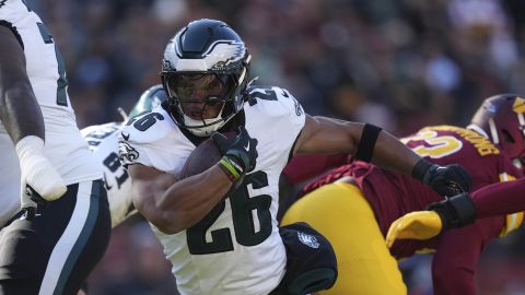 Philadelphia Eagles running back Saquon Barkley (26) running with the ball during the first half of an NFL football game against the Washington Commanders, Sunday, Dec. 22, 2024, in Landover, Md. (AP Photo/Stephanie Scarbrough)