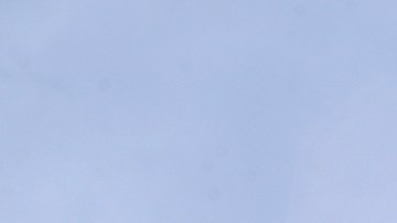 Trinh Nguyen, of the Camarillo Fire Dept, monitors the advance of the Easy Fire Wednesday, Oct. 30, 2019, in Simi Valley, Calif. Driven by powerful Santa Ana winds, the brush fire broke out before dawn between the cities of Simi Valley and Moorpark north of Los Angeles and exploded to more than 1,300 acres (526 hectares), threatening 6,500 homes, Ventura County officials said. (AP Photo/Marcio Jose Sanchez)