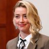 Amber Heard arrives into the courtroom after a break at the Fairfax County Circuit Courthouse in Fairfax, Va., Monday, May 23, 2022. Actors Johnny Depp and Heard have settled their defamation lawsuits following a high-profile trial earlier this year in which the former couple accused each other of physical and verbal abuse. Heard announced the settlement Monday, Dec. 19, on social media. (AP Photo/Steve Helber, Pool, File)