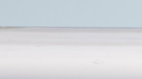 FILE - A Los Angeles Unified School District bus driver walks past parked vehicles at a bus garage in Gardena, Calif., on Dec. 15, 2015. Tens of thousands of workers in the Los Angeles Unified School District will strike for three days next week over stalled contract talks and teachers will join them, likely shutting down the nation's second-largest school system, union leaders announced Wednesday, March 15, 2023. (AP Photo/Damian Dovarganes, File)