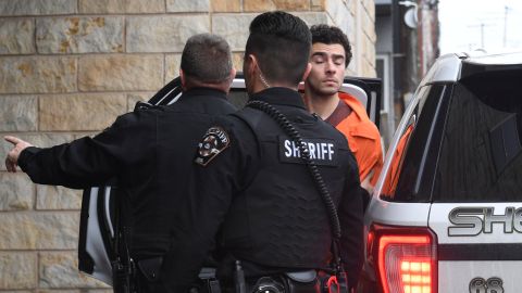 Luigi Nicholas Mangione is escorted into Blair County Courthouse, Tuesday, Dec. 10, 2024, in Hollidaysburg, Pa. (AP Photo/Gary M. Baranec)