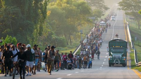 Migrants walk along the highway in Huixtla, southern Mexico, heading toward the country's northern border and ultimately the United States, Thursday, Nov. 7, 2024. (AP Photo/Moises Castillo)