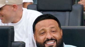 left, DJ Khaled, second from left, Diddy, and Rauw Alejandro, right, sit in a VIP area before a Leagues Cup match between Inter Miami and Atlanta United, Tuesday, July 25, 2023, in Fort Lauderdale, Fla. (AP Photo/Lynne Sladky)
