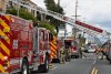 Los Angeles firefighters pack up after a fire at an apartment complex in the Sun Valley area of Los Angeles, Thursday, March 23, 2023. The fire in the Sun Valley area erupted at midday and flames were lapping up from a second-floor unit to the third floor when firefighters arrived, Fire Department spokesperson Margaret Stewart said in a statement. Several residents took refuge on top-floor balconies while firefighters attacked the flames. (AP Photo/Richard Vogel)