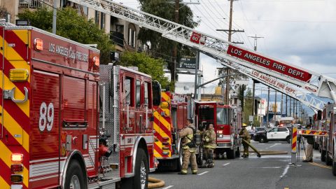 Los Angeles firefighters pack up after a fire at an apartment complex in the Sun Valley area of Los Angeles, Thursday, March 23, 2023. The fire in the Sun Valley area erupted at midday and flames were lapping up from a second-floor unit to the third floor when firefighters arrived, Fire Department spokesperson Margaret Stewart said in a statement. Several residents took refuge on top-floor balconies while firefighters attacked the flames. (AP Photo/Richard Vogel)