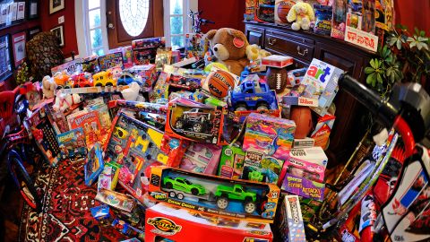 Frank Duffy organized a toy drive that filled his real estate office with 275 toys donated by clients and employees before he matched the donations out of his own pocket and then delivers them to the Toys for Tots charity on Friday, Dec. 19, 2014, in Alpharetta, Ga. (AP Photo/David Tulis)