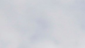 FILE - In this April 29, 2018, file photo, a drone operator helps to retrieve a drone after photographing over Hart Island in New York. (AP Photo/Seth Wenig, File)