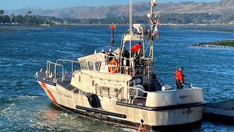 In this photo provided by the U.S. Coast Guard, a U.S. Coast Guard crew moors a boat to a pier in Bodega Bay, Calif, on Sunday, Nov. 3, 2024, after searching for a group of boaters that went missing near Bodega Bay. (United States Coast Guard via AP)