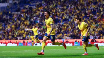 Jugadores de América en festejo de gol.