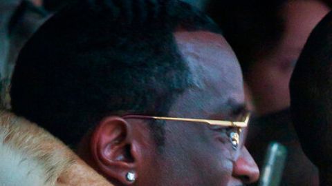 Sean Combs, from left, Jay Z, and Beyonce watch as Kanye West's Yeezy Boost shoe line for Adidas is shown during Fashion Week in New York on Thursday, Feb. 12, 2015. (AP Photo/Bebeto Matthews)