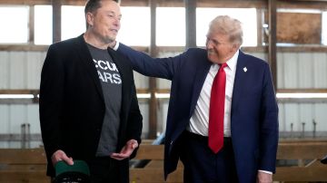 FILE - Tesla and SpaceX CEO Elon Musk, left, and Republican presidential nominee former President Donald Trump attend a campaign event at the Butler Farm Show, Oct. 5, 2024, in Butler, Pa. (AP Photo/Alex Brandon, File)