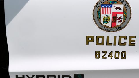 A Los Angeles Police Department sticker is seen on a door panel of a prototype of the Ford Fusion police hybrid car in Los Angeles, Monday, April 10, 2017. Ford Motor Co., which sells more police cars in the U.S. than any other automaker, says it will offer a police pursuit version of the hybrid Fusion midsize sedan, in response to requests from cities nationwide. (AP Photo/Richard Vogel)