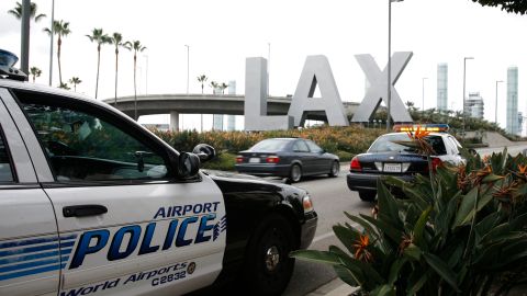 Airport police monitor the entrance of Los Angeles International Airport in Los Angeles, Saturday, Dec. 26, 2009. Aviation security officials worldwide boosted safety restrictions on travelers headed to the U.S. after an attempted Christmas Day terrorist attack on a flight from Europe to Detroit, imposing extra screening and new limits on carry-on luggage. (AP Photo/Jason Redmond)