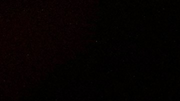 People hold candles during an outdoor Service of Lights Christmas Eve service at the Granada Presbyterian Church, Thursday, Dec. 24, 2020, in Coral Gables, Fla. The service was held outdoors for safety reasons to protect against the spread of the coronavirus. (AP Photo/Lynne Sladky)