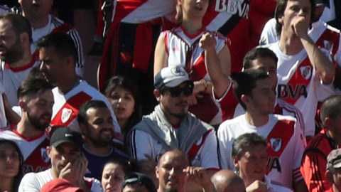 Argentina's River Plate fans cheer for their team prior the final soccer match of the Copa Libertadores against Argentina's Boca Juniors at the Antonio Vespucio Liberti stadium in Buenos Aires, Argentina, Saturday, Nov. 24, 2018. The final match of the Copa Libertadores has been pushed back after the bus carrying the Boca Juniors players was attacked by fans as it drove to the Antonio Vespucio Liberti stadium. (AP Photo/Ricardo Mazalan)