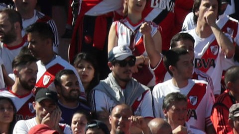 Argentina's River Plate fans cheer for their team prior the final soccer match of the Copa Libertadores against Argentina's Boca Juniors at the Antonio Vespucio Liberti stadium in Buenos Aires, Argentina, Saturday, Nov. 24, 2018. The final match of the Copa Libertadores has been pushed back after the bus carrying the Boca Juniors players was attacked by fans as it drove to the Antonio Vespucio Liberti stadium. (AP Photo/Ricardo Mazalan)