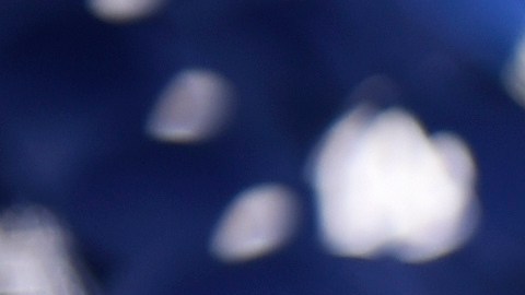 Los Angeles Dodger caps to be distributed to fans sit in a pile before the Dodger Day Drive-Thru at Belvedere Park, Tuesday, June 30, 2020, in Los Angeles. The event was hosted by The Los Angeles Dodgers Foundation, which distributed food boxes, books, sports equipment, clothing, toys and hygiene supplies to over 1000 registered youth from the Boyle Heights, East Los Angeles, La Puente and Monterey Park communities. (AP Photo/Chris Pizzello)