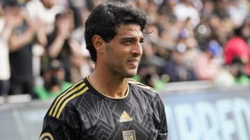 Los Angeles FC's Carlos Vela stands on the field during the second half of an MLS soccer match against the Colorado Rapids Saturday, Feb. 26, 2022, in Los Angeles. (AP Photo/Jae C. Hong)