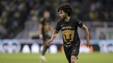 Pumas' Cesar Huerta runs for the ball during a Mexican soccer league match against America at Azteca stadium in Mexico City, Saturday, April 22, 2023. (AP Photo/Moises Castillo)