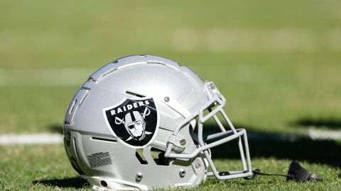 Las Vegas Raiders helmet sits on the field before an NFL football game between the Chicago Bears and Las Vegas Raiders, Sunday, Oct. 22, 2023, in Chicago. (AP Photo/Kamil Krzaczynski)