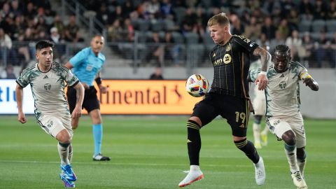 Los Angeles FC midfielder Mateusz Bogusz (19) controls the ball against the Portland Timbers during the first half of an MLS soccer match Saturday, April 27, 2024, in Los Angeles. (AP Photo/Marcio José Sanchez)