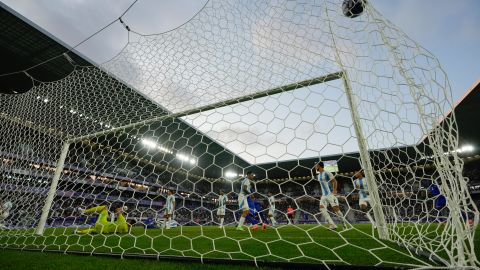 A shot by France's Jean-Philippe Mateta sails into the net past Argentina's goalkeeper Geronimo Rulli for the French side's first goal, during a quarter final soccer match between France and Argentina, at Bordeaux Stadium, during the 2024 Summer Olympics, Friday, Aug. 2, 2024, in Bordeaux, France. (AP Photo/Rebecca Blackwell)