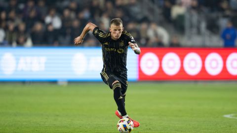 Los Angeles FC midfielder Mateusz Bogusz (19) dribbles during an MLS Western Conference semifinal soccer match against the Seattle Sounders in Los Angeles, Saturday, Nov. 23, 2024. (AP Photo/Kyusung Gong)