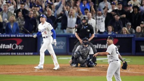 FILE - New York Yankees relief pitcher Nestor Cortes, right, watches as Los Angeles Dodgers' Freddie Freeman, left, hits a walk-off grand slam home run during the 10th inning in Game 1 of the baseball World Series, Friday, Oct. 25, 2024, in Los Angeles. (AP Photo/Mark J. Terrill, File)