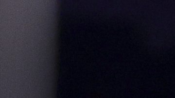 Los Angeles Lakers forward Anthony Davis, frint right, drives against Cleveland Cavaliers guard Max Strus, left, and forward Dean Wade, center, during the second half of an NBA basketball game Tuesday, Dec. 31, 2024, in Los Angeles. (AP Photo/Ryan Sun)