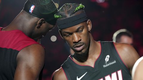 Miami Heat forward Jimmy Butler (22) and center Bam Adebayo, left, are introduced before an NBA basketball game against the Indiana Pacers Thursday, Jan. 2, 2025, in Miami. (AP Photo/Lynne Sladky)