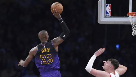 Los Angeles Lakers forward LeBron James, left, shoots as Portland Trail Blazers center Donovan Clingan defends during the second half of an NBA basketball game, Thursday, Jan. 2, 2025, in Los Angeles. (AP Photo/Mark J. Terrill)