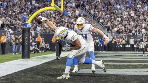 Los Angeles Chargers tight end Tucker Fisk (42) spikes thew ball after teammate Will Dissly (81) scores a touchdown against the Las Vegas Raiders in an NFL football game, Sunday, Jan. 5, 2025, in Las Vegas. Chargers defeated the Raiders 34-20. (AP Photo/Jeff Lewis)