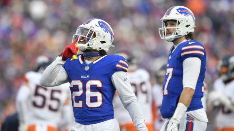 Buffalo Bills running back Ty Johnson (26) gestures to fans as quarterback Josh Allen looks on during the second half of an NFL football wild card playoff game against the Denver Broncos in Orchard Park, N.Y., Sunday, Jan. 12, 2025. (AP Photo/Adrian Kraus)