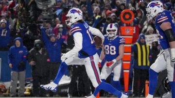 Buffalo Bills quarterback Josh Allen (17) carries the ball into the end zone to score a touchdown against the Baltimore Ravens during the second quarter of an NFL divisional playoff football game, Sunday, Jan. 19, 2025, in Orchard Park, N.Y. (AP Photo/Gene J. Puskar)